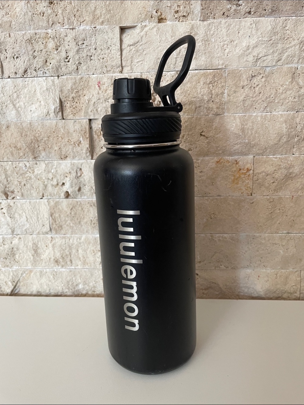 Lululemon black metal water bottle.